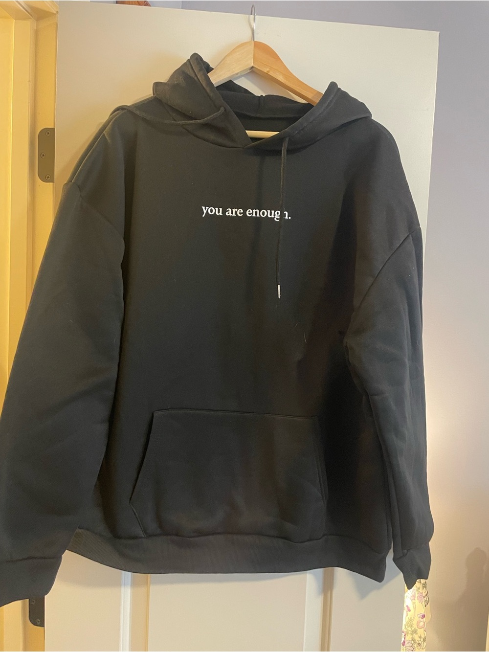 Black 'you are enough.' Hooded Sweatshirt
